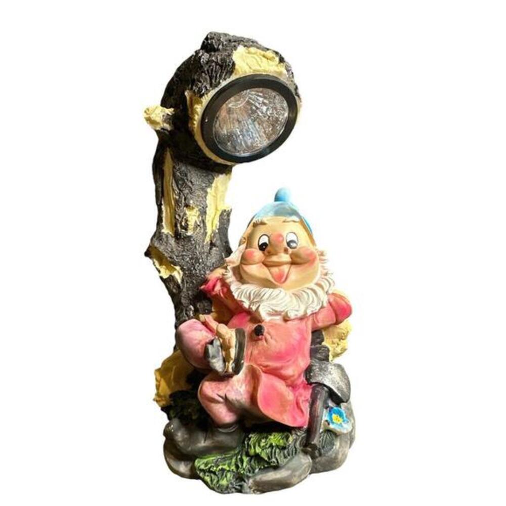 This Solar Garden Gnome is relaxing under a tree, showing off his brightest outf
